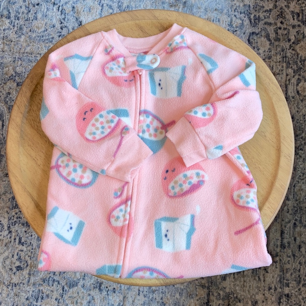 #81. Carter’s - Pink Fleece Footed Sleeper with Cereal & Milk Print